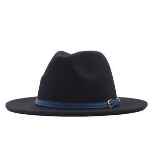 Detail view showing the texture of a black suede fedora with a blue buckled faux leather band.