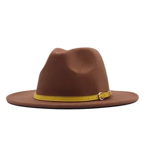Detailed side view of a vintage brown suede fedora with a stylish yellow buckled strap.