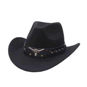 Detailed view of a vintage black suede cowboy hat with a metal bull head decorative band.