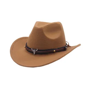 Side view of a tan faux suede cowboy hat with a decorative bull skull leather band