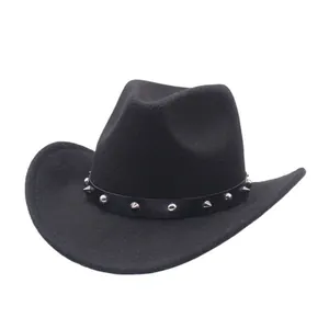Close-up detail of a black suede cowboy hat featuring a punk style silver studded band