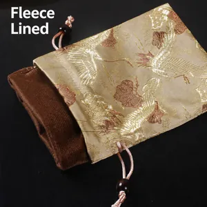 Pochette à cordon élégante pour bijoux avec broderie grue et doublure velours douce
