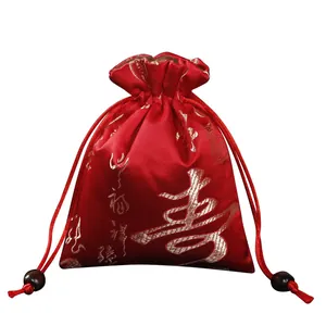 Pochette à bijoux chinoise rouge traditionnelle avec broderie dorée de longévité