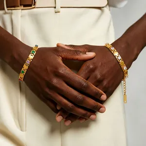 Detail view of 18K gold plated chain bracelets with colorful and clear square zirconia stones
