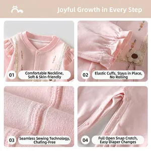 Pink long sleeve cotton baby romper with ruffled shoulders and snap buttons