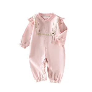 Pink baby girl cotton romper with lace floral embroidery and ruffled details