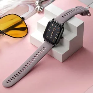 Close-up detail of a minimalist GEDI square dial women's watch with a grey strap.