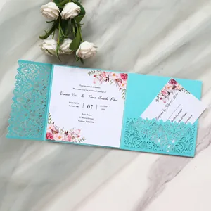 Detailed view of the tiffany blue laser-cut wedding invitation with elegant floral card