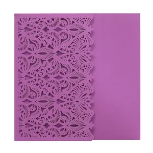 Detailed view of purple laser-cut wedding invitation with elegant floral pattern