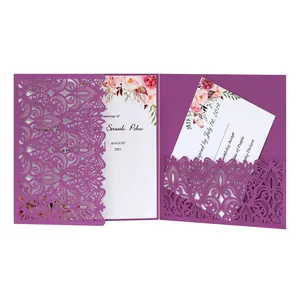 Detailed view of laser-cut purple wedding invitation with floral inner response card