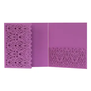 Macro detail of an intricate purple laser-cut pattern on a wedding invitation pocket