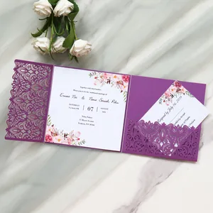 Detailed view of elegant purple laser-cut wedding invitation card with floral motifs