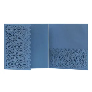 Detailed view of the intricate laser-cut floral pattern on navy blue invitation card