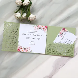 Detail view of sage green laser-cut wedding invitation with floral insert and RSVP card.