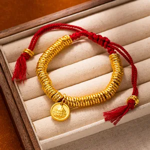 Elegant ancient gold style red rope bracelet featuring Yellow Dzambhala deity charm
