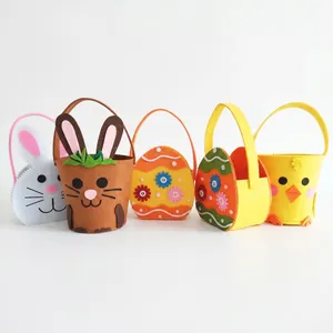 Handmade Easter felt gift baskets with bunny and chick designs for holiday treats and candy