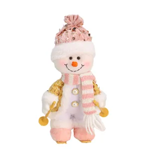 Adorable Christmas plush snowman doll wearing a sequin pink knit hat holding ski poles