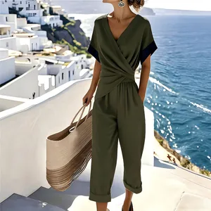 Elegant olive green wrap V-neck jumpsuit with wide-leg pants for a stylish summer commute