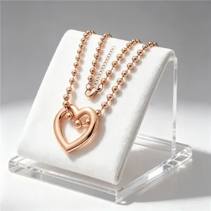 Elegant rose gold heart-shaped hollow pendant necklace with a stylish beaded chain detail