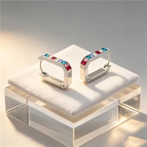 Detailed view of U-shaped stainless steel earrings with colorful square zircons.
