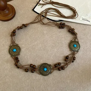 Bohemian style woven waist chain with wood beads and turquoise-like accents