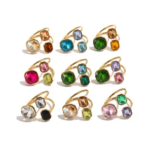 Collection of 18K gold plated open rings featuring colorful geometric faceted crystals.