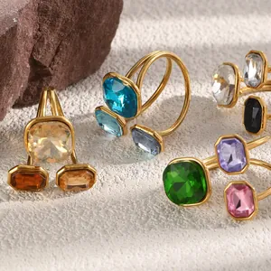 Detailed view of vibrant geometric crystal open rings with polished 18K gold plating