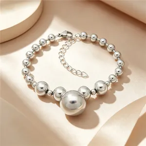 Detail view of silver titanium steel bead bracelet with lobster clasp and extension chain