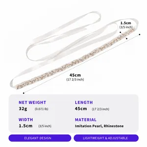 Detail view of handmade bridal belt with imitation pearls and sparkling rhinestones