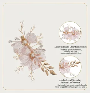 Detail view of handmade gold wire hair clip with translucent pink flowers and pearls