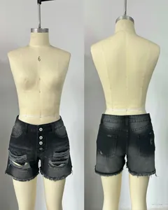 Detailed front and back view of women's black high-waisted distressed denim shorts with raw hem