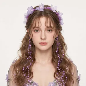 Detail view of handmade forest style floral headband with purple pearl tassels
