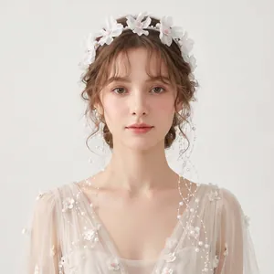 Elegant forest-style fabric flower headband featuring delicate pearl tassels and floral details.