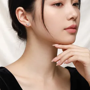 Elegant S925 silver butterfly stud earrings with sparkling moissanite on female model