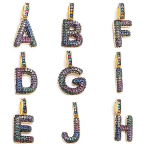Detailed view of nine colorful zircon alphabet pendants A to J in gold-plated settings
