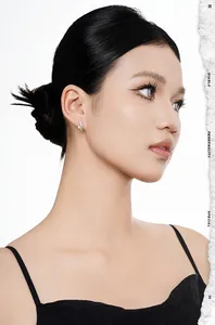 Detail of model wearing S925 sterling silver flower earrings with irregular texture