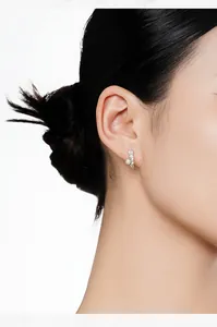 Detailed close-up showing elegant S925 sterling silver flower ear cuff on a model's ear