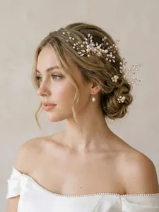 Detailed view of vintage bridal hair comb with pearls and rhinestones on elegant bun