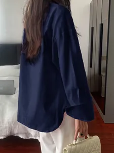 Elegant navy blue long-sleeved blouse shown from the back view for women's style