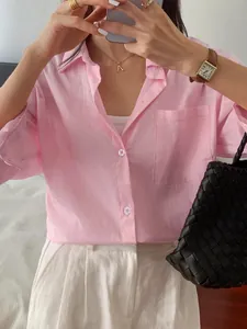 Elegant pink long-sleeve linen shirt for women perfect for vacation and leisure style