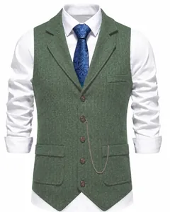 Detailed view of a green herringbone tweed men's vest with lapels and chain detail
