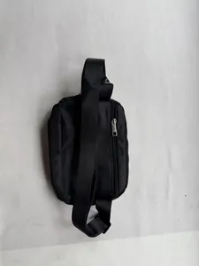 Rear view detail of black nylon waist bag with secure zipper and adjustable strap