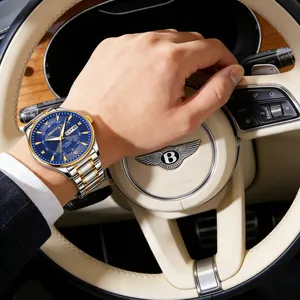 Detail showing a luxury men's steel watch with blue dial and diamond-set hour markers.