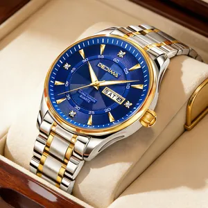Close-up detail of luxury men's two-tone watch with blue dial and day-date display