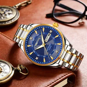 Detailed close-up of luxury men's quartz watch featuring a blue dial and two-tone steel band