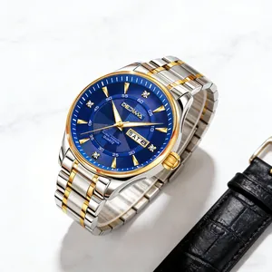 Detail of blue sunray dial mens watch with gold markers and dual calendar display