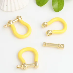 Macro view of copper U-shaped horseshoe clasp with yellow enamel for DIY jewelry accessories