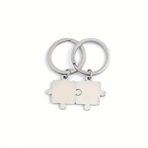 Pair of polished stainless steel interlocking puzzle piece keychains for couples gift