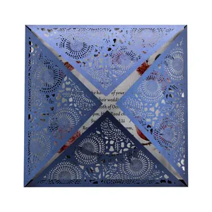 Elegant blue laser-cut floral wedding invitation card with intricate petal fold design