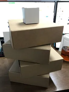 Macro view of several plain brown cardboard shipping boxes used for Christmas ornaments